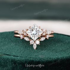 an engagement ring with a princess cut diamond in the center