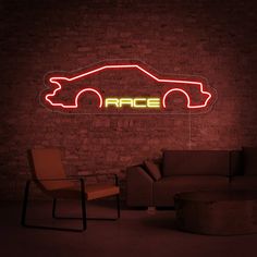 a neon sign that reads race in front of a brick wall with a couch and chair