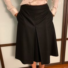 This Black Felt Skirt Made By Chlo Still Has The Tags On It. It Is In Perfect Condition. It Is A Size 38. It Includes Side Zipper And Button. Also Includes Front Pockets. Made Of Black Wool With Small Copper Decorative Bullets Around The Waist. Originally $855. Elegant Black A-line Skirt, Black A-line Bottoms For Workwear, Black A-line Pleated Bottoms, Elegant Skirt Bottoms With Pockets, Black Knee-length Office Bottoms, Knee-length Black Office Bottoms, Formal Wide Leg Skirt With Pockets, Formal Wide-leg Skirt With Pockets, Formal Flared Skirt With Pockets