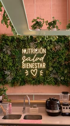 a kitchen counter with a neon sign above it