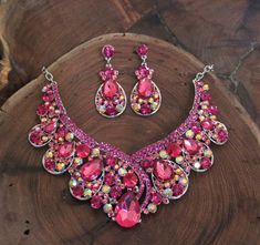 Pink Rhinestone Jewelry Set For Party, Glamorous Pink Rhinestone Necklace For Party, Pink Crystal Rhinestone Necklace For Wedding, Pink Crystal Jewelry Sets With Rhinestones, Pink Rhinestone Party Necklaces, Glamorous Pink Rhinestone Necklace, Pink Crystal Necklace With Rhinestones, Pink Crystal Rhinestone Necklace, Pink Crystal Glamorous Necklace