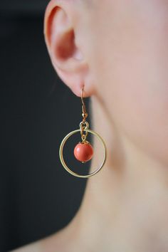 This lovely earrings was made of peach coral color glass 10 mm beads, gold plated brass bead caps, gold tone open circle charms and gold plated brass base earrings hooks. Earring hooks are from nickel free and lead free metal. *The total lenght of earrings is about 45 mm including earring hooks. Other earrings of my shop you can see here: https://www.etsy.com/shop/NaTavelli?section_id=13757927 Thanks for visit. Orange Dangle Pierced Jewelry, Orange Metal Jewelry With Matching Earrings, Orange Copper Dangle Jewelry, Orange Circular Jewelry As A Gift, Orange Circular Jewelry Gift, Minimalist Orange Drop Earrings, Orange Dangle Earrings Minimalist Style, Orange Minimalist Dangle Jewelry, Minimalist Orange Dangle Jewelry