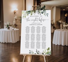 a sign that is on top of a easel in front of a wooden floor