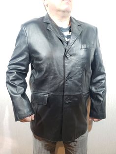 Stylish men's leather jacket. Classic black men's jacket made of genuine leather. Leather jacket made of durable leather with pockets. The jacket is made of durable soft genuine leather. The jacket fastens easily with plastic buttons. There are two convenient pockets at the bottom of the jacket and one at the top on the left. There are also three pockets inside the jacket for your convenience. The jacket has a nice polyester lining. The jacket is stylish, pleasant, good and reliable in operation. The jacket will add variety to your style. The jacket is suitable both for work and for a business party and will become a pleasant accessory during a trip. MEASUREMENTS Jacket length                    81 cm  |  32 in Pit to pit                           62 cm  |  24.5 in Chest  circumference Mens Black Jacket, Business Party, Men In Black, Men's Leather Jacket, Jacket Buttons, Stylish Men, Men's Jacket, Classic Black, Leather Men