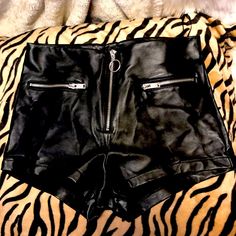 Faux Leather Shirt Shorts. With Zipper In Front And Two Small Zipper Pockets. Never Worn. In Excellent Condition. Stretchy Pleather. Waist 28”. Edgy Shorts With Zipper Closure, Edgy Fitted Shorts With Zipper Closure, Edgy Shorts With Zipper Closure For Spring, Edgy Spring Shorts With Zipper Closure, Trendy Fitted Shorts With Zipper Closure, Edgy High-waisted Faux Leather Shorts, Trendy Fitted Faux Leather Shorts, Edgy Black Faux Leather Shorts, Edgy High Waist Shorts With Zipper Closure