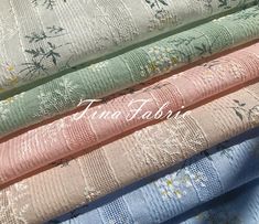 four different colors of fabric with flowers on them