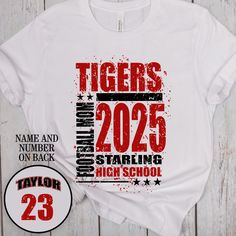 a white t - shirt with the words tigers in red and black ink on it