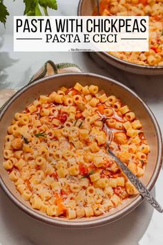 two bowls of pasta with cheese and tomato sauce