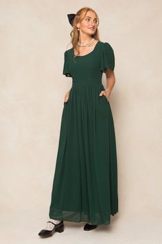 Twirl in style with the Abbie Dress in Emerald Chiffon. The flowy chiffon fabric and subtle sweetheart neckline provide a romantic touch, while the short bell sleeves and maxi-length skirt with functional pockets add a playful twist. This dress is not only the ultimate fall bridesmaids silhouette, but perfect for date Short Bell Sleeves, Fall Bridesmaids, Thanksgiving Dress, Girls Holiday Dresses, City Woman, Green Bridesmaid Dresses, White Dress Party, Holiday Party Dresses, Mom Dress