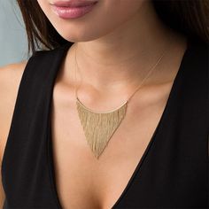 Update your dressy attire with this sensational bib necklace. Created in warm 10K gold, this stylish look features a curved bar adorned with shimmering tapered lengths of diamond-cut bead chain. Buffed to a brilliant luster, this design suspends centered along a 16.0-inch bead chain with 2.0-inch extender that secures with a spring-ring clasp. Chic Yellow Gold Necklaces For Evening, Evening Yellow Gold Necklace With Delicate Chain, Elegant Gold Bib Necklace With Adjustable Chain, Elegant 14k Gold Bar Necklace With Adjustable Chain, Gold Diamond Cut Necklace For Evening, Yellow Gold Diamond Cut Necklace For Party, Modern Yellow Gold Necklaces For Evening, Elegant Gold Bib Necklace As A Gift, Elegant Gold Bar Necklace With Adjustable Chain