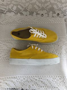 Canvas sneakers Yellow Vintage shoes Tennis woman Size 38.5 Sneakers relaxation Comfortable Brand: not specified Inscribed size: 39, small shoe, corresponds to a 38.5 Type of shoes: sneakers, casual shoes, tennis, summer sneakers Closure: lace-up era: 80s Top material: canvas, textile Outer sole material: rubber Color: yellow, white laces and sole Heel: 3 cm / 1.18 inches Insole measurement 24.5 cm / 9.64 inches note slight signs of use Very good condition Vintage Ref.964C I try to describe prec Sporty Canvas Slip-on Sneakers For Summer, Sporty Flat Canvas Shoes For Sports, Trendy High-top Sneakers For Leisure, Trendy Round Toe Sneakers For Leisure, Trendy Sports Canvas Shoes With Rubber Sole, Sporty Flat Canvas Shoes, Trendy Canvas Shoes With Rubber Sole For Sports, Trendy Low-top Summer Sneakers, Trendy Low-top Sneakers For Summer