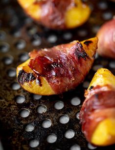 bacon wrapped potatoes on a grilling pan