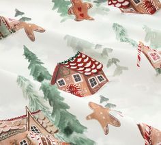 the fabric has gingerbread houses and trees on it