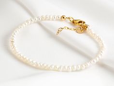 "This beautiful bracelet is easy to wear, and incredibly feminine. It is handmade by us in our atelier, each pearl is carefully selected and hand placed. ▲▽ M A T E R I A L ▽▲ * Sterling Silver (925) * 14k Gold Filled ------------------------------------------------------------- ▲▽ S I Z E ▽▲ * Fits all adjustable bracelet : 16 -18 cm | 6,3\" - 7,1\" * Pearl sizes: ~2 mm ------------------------------------------------------------- ▲▽ G E M ▽▲ * Natural Pearls * High grade pearls --------------- Pearl Strand, Choker Pendant, Back Necklace, Bracelet Dainty, Dainty Bracelet, Hair Accessories Gift, Freshwater Pearl Bracelet, Pearl Strands, Pearl Gemstone