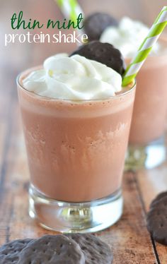 two glasses filled with chocolate pudding and whipped cream