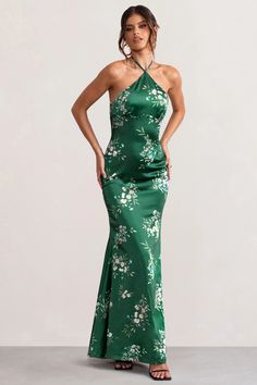 Look and feel utterly divine in our green floral print Grandeur halter neck maxi dress. Constructed in luxurious satin and with a cascading hemline, this stunning floor-sweeping gown is worthy of the red carpet. It's cut in a way that contours your curves beautifully – it cinches in at the waist and falls into an elegant fishtail shape, creating a gorgeous hourglass silhouette. This showstopping evening gown is essential for those special occasions. Red-carpet worthy!    Features  - Halter neckline  - Open back detail  - Floral print  - Premium satin fabric     Sizing & Fit   Model is 5’9 and wears UK size 8 / US size 4      Product Information      Slight stretch   Satin fabric (95% Polyester 5% Elastane)   Length from top of shoulder to hem: 157cm   SKU: CL126538 Green Halter Neck Dress For Formal Occasions, Green Maxi Length Halter Dress For Evening, Green Satin Halter Neck Dress, Green Halter Maxi Dress For Evening, Green Halter Neck Maxi Dress For Prom, Green Maxi Halter Dress For Evening, Green Floral Print Prom Dress, Elegant Green Halter Neck Maxi Dress, Green Floor-length Satin Evening Dress