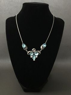 Vintage Van Dell Sterling Silver Aquamarine and Clear Rhinestones Filigree Necklace Beautiful vintage condition. The hallmark stamped on the necklace and pendant holder. Necklace length: 16" (40.6 cm);  Pendant size: 3" (7.6 cm) long with clasp;   Width: 1 1/8" (2.9 cm). Total Weight: 14 grams   Item is exactly as shown in pictures.    Please carefully review the item description and accompanying pictures before making a purchase, as we do not offer a return or exchange policy. If you have any q Vintage Sterling Silver Necklace With Diamond Accents, Vintage Sterling Silver Necklaces With Diamond Accents, Silver Jeweled Necklace For Anniversary, Silver Jeweled Fine Jewelry, Fine Silver Jeweled Jewelry, Silver Rhinestone Jeweled Necklace For Anniversary, Silver Rhinestone Anniversary Necklace, Silver Rhinestone Necklace With Jewels For Anniversary, Silver Rhinestone Necklace For Anniversary