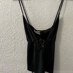 Crisscross Tie Cut Out Whit Circle Detail At The Front V- Neck Size: Medium Color:Black Condition:Brand New With Tags Offers Are Welcome Black Top With Built-in Bra For Day Out, Chic Tops With Crisscross Straps For Night Out, Black Crisscross Straps Crop Top, Chic Black V-neck Crop Top, Chic Cami Top With Crisscross Straps, Fitted Tops For Night Out With Cross Back, Crisscross Straps Crop Top For Night Out, Crisscross Back Crop Top For Night Out, Fitted Cross Back Top For Night Out