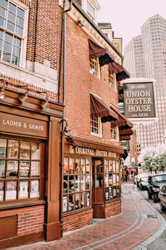 an old brick building on the corner of a street