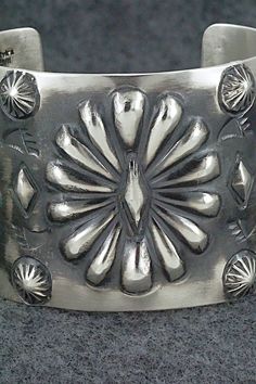 This stunning sterling silver bracelet was made by Navajo silversmith Elvira Bill. The inside is signed Elvira Bill and stamped sterling.Size: 5 7/8" (will fit up to a 7 1/4" wrist)Gap: 1 3/8"Width: 2"Free shipping on all orders! We ship with USPS and always include tracking. All orders ship within a day of payment.Returns are accepted up to 30 days after you receive your order. Just send us a message. Our shop offers cash back or store credit. The item must be returned in new condition. Artisan Silver Concho Cuff Bracelet, Artisan Sterling Silver Concho Cuff Bracelet, Southwestern Silver Bracelets With Concho, Sterling Silver Bracelets, Silver Bracelet, Stamp, Sterling Silver, Silver