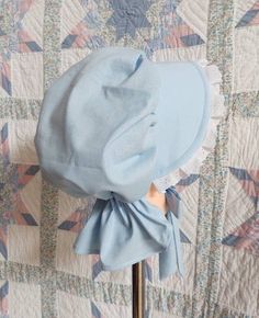 This pretty bonnet is suitable for most Historical events. Our poke bonnet features white eyelet lace around the brim and an adjustable back so that it will fit most head sizes. The brim is filled and quilted with a felt insert, so that it will stay stiff and not droop in the rain. The back of the bonnet has a curtain to protect the neck from sunburn. The bonnet is made from 100% cotton muslin in your choice of pastel color so can be machine washed. Properly taken care of, this item should provi Cotton Bonnet Cap, Adjustable Cotton Bonnet With Lace Trim, Fitted Cotton Bonnet With Lace Trim, Adjustable Cotton Vintage Bonnet, Adjustable Brimmed Cotton Bonnet, Pioneer Wagon, Prairie Bonnet, Poke Bonnet, Cotton Muslin