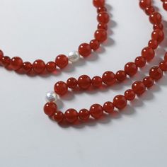 Embark on a journey of auspiciousness with our stunning Natural Red Agate Necklace and Bracelet set – where good fortune meets timeless beauty! 🔴✨Let the red waves of luck and prosperity adorn you in the upcoming New Year! 🧧 Key Features: Material: Authentic red agate beads paired with a lustrous natural pearl for a touch of elegance. Symbolism: Embrace the vibrant energy of the New Year with the auspicious hues of red, symbolizing luck and prosperity. Unique Touch: Each set features natural a Red Waves, Red Agate Necklace, Agate Stone Necklace, Necklace And Bracelet Set, Vibrant Energy, Onyx Bracelet, Gemstone Beaded Bracelets, Agate Necklace, Red Agate