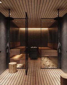 an indoor sauna with wooden floors and benches