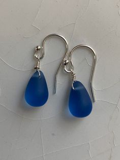 Nickel-free Blue Sea Glass Earrings, Blue Sea Glass Nickel-free Earrings, Blue Sea Glass Nickel Free Earrings, Nickel-free Teardrop Earrings In Recycled Glass, Nickel-free Teardrop Earrings Made Of Recycled Glass, Teardrop Sea Glass Earrings With Ear Wire, Blue Recycled Glass Dangle Earrings, Elegant Blue Sea Glass Jewelry, Teardrop Sea Glass Earrings For Gift