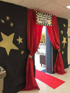 an open door with red curtains and stars on it