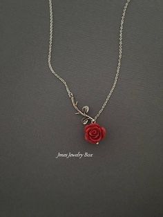 Sweet red rose and silver branch necklace. Very dainty but sturdy. Silver branch and red rose are on an 18'' stainless steel chain with lobster clasp. *Stainless steel chain *Silver brass branch *15mm resin rose *Handmade with love <3 Also available as a bracelet https://www.etsy.com/listing/665169824/silver-branch-and-red-rose-bracelet-rose?ref=shop_home_active_1 Like Jmesjewelrybox on Facebook for updates on new jewelry, upcoming sales and giveaways! Plus Facebook fans save 5% :D Find the c Red And Silver Necklace, Red Rose Necklace, Beauty And The Beast Necklace, Red Rose Jewelry, Rose Branch, Rose Accessories, Rose Jewellery, Rose Pendant Necklace, Deer Jewelry