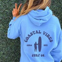 "Coastline, Surfboard Hoodie | Beach Bum sweatshirt, Beach Day, Surf shop Sorority Shirts: https://etsy.me/34dVqt9 Sorority Sweatshirts: https://etsy.me/360xXMs Sorority Accessories: https://etsy.me/30SCQVv 🌻 Please read the full description: This hoodie/sweatshirt sizing is NOT oversized. You need to order at least 1-2 sizes larger for the extra baggy look in this photo. (The normal sizing is UNISEX.) 🔔 Example: if you use size S choose between a size L or XL. 💡 HOW TO PLACE YOUR ORDER: 1. P Sorority Accessories, Preppy Hoodie, Clothes Preppy, Ocean Surfing, Surf Hoodie, Save The Ocean, Sorority Sweatshirts, Beach Sweatshirt, Ocean Surf