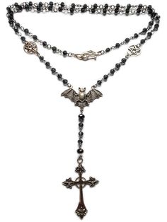 With a full length of approx 90cm this item can be worn as a long single strand or doubled up for a choker effect.  The ornate clasp sits in front when doubled up adding to the beauty and versatility of this piece.  Each faceted glass bead is linked on stainless steel that will not rust or tarnish with wear. the gothic cross pendant is approx 7 cm in length and is made of  silver toned alloy, as is the bat and pentacles.  Lovingly handcrafted , this necklace is sure to please! Long Gothic Necklace, Gothic Necklaces With Beaded Metal Chain, Gothic Metal Necklace With Beaded Chain, Adjustable Victorian Metal Necklace, Elegant Single Strand Jewelry For Festival, Beaded Metal Lariat Necklace, Vintage Double Strand Beaded Chain Jewelry, Gothic Beaded Cross Jewelry, Gothic Beaded Jewelry For Festival