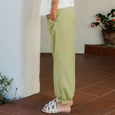 Elevate your everyday look with the Green Pintuck Tapered Leg Pants. Their sleek design and pintuck detailing add a touch of sophistication to any outfit. Product code: CAA02D4A026HH Spring Loungewear Harem Pants, Summer Solid Color Straight Dress Pants, Summer Straight Dress Pants In Solid Color, Summer Stretch Dress Pants In Solid Color, Summer Straight Dress Pants Solid Color, Solid Color Straight Dress Pants For Summer, Stretch Dress Pants For Summer, Spring Versatile High-waisted Sweatpants, Versatile Spring High-waisted Sweatpants