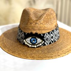 Brown Palm Leaf Straw Hat . Hand Made Design . Fits All. One Size . Perfect Beach Hat . Summer Beach Hat Bands, Bohemian Beach Fedora, One Size, Bohemian Beach Fedora In One Size, Adjustable Hat For Vacation, Bohemian Straw Hat For The Beach, Bohemian Straw Hat For Beach, Adjustable Beach Fedora One Size, Adjustable Woven Hats, Adjustable One Size Fedora For Beach