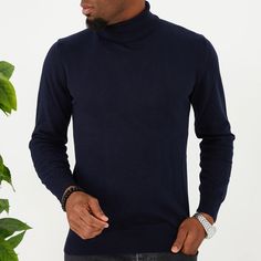 Slip into comfortable designer stylings in this handsome long-sleeved turtleneck with a traditional ribbed cuff design for versatility when paired with casual or semi-formal outfits. Classic Long Sleeve Turtleneck For Fall, Classic Long Sleeve Fall Turtleneck, Casual Funnel Neck Turtleneck For Work, Winter Business Casual Turtleneck Tops, Casual Winter Turtleneck With Ribbed Cuffs, Navy Turtleneck Top For Fall, Long Sleeve Turtleneck With Ribbed Collar For Layering, Casual Turtleneck With Ribbed Collar For Work, Casual Ribbed Collar Turtleneck For Work