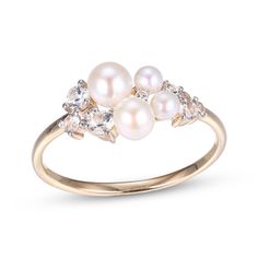 This ring is a lovely way to add sophistication to your look. Crafted in 10K yellow gold with white rhodium details, the design features a quartet of lustrous round freshwater cultured pearls. Varied sizes of round-cut white lab-created sapphires add sparkle here and there to complete the design. Pearl Wedding Ring Set, Gold Layered Bracelets, Pearl Wedding Ring, Neil Lane Engagement Rings, Pearl Diamond Jewelry, Pearl Rings Vintage, Cross Jewelry Necklace, Fan Jewelry, White Lab