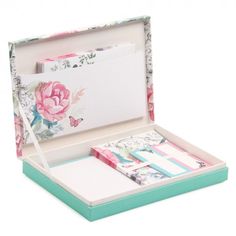 an open box with cards and envelopes in it