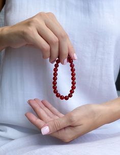 Authentic | High Grade | USA | 3 Days Free Shipping | ASANA Red carnelian bracelet This red carnelian bracelet is a beautiful and unique piece of jewelry. It is made of red carnelian gemstones, which are known for their vibrant color. This bracelet would make a great gift for someone who loves unique and eye-catching jewelry. * 100% Authentic Gemstones * Ethically Sourced * Asana Crystals (USA Brand) * By Women for Women * 8MM - Perfect casual size * 30 Days Easy Return Carnelian Metaphysical Me Red Carnelian Bracelets With 8mm Beads, Carnelian Round Beads Bracelet For Gift, Amber Carnelian Beaded Bracelets - Gift, Amber Carnelian Beaded Bracelet Gift, Red Carnelian Bracelets With Polished Beads, Red Carnelian Beaded Bracelets For Gift, Red Carnelian Bracelets As A Gift, Red Carnelian Bracelets As Gift, Red Carnelian Bracelets For Gifts