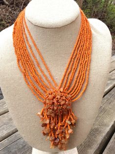 vintage orange seed bead necklace multi strand tropical fringed fashion wardrobe ITEM DESCRIPTION: Offering this beautiful, tiny orange seed beaded necklace accented with orange polished stone chips. circa estimated 1980s-90s This statement necklace has some weight; the wispy orange 'stones' could be glass or genuine tiny stones. MEASUREMENTS: This sweet citrus necklace measures approximately 11 inches long (wearable and total length).  CONDITION: Such a fun tropical fashion piece and in good vi Seed Beaded Necklace, Fall Fashion Accessories, Beach Wedding Jewelry, Necklaces Vintage, Tropical Fashion, Orange Decor, Jewelry Beach, Wardrobe Accessories, Hawaiian Beach