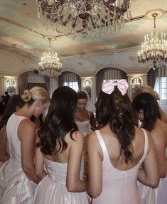 the bridesmaids are getting ready to go into their wedding ceremony in pink dresses