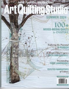 the front cover of an art quilting studio magazine, featuring a tree in winter