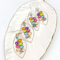 Colorful and happy statement elegant hoops with stunning Kaleidoscope of gems centered in a Marquee shape hoop. Length: 2″ May we recommend a great pairing with any of our favorite Zina Necklaces or Marque Mixed Shape necklace (sold separately). Sterling Silver Earrings, Hoop Earrings, Gems, Sterling Silver, Silver, Color