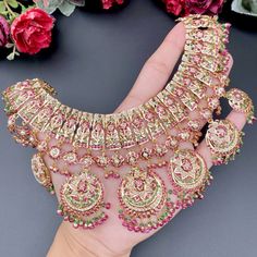 Featuring an intricate and beautifully carved heavy bridal jadau necklace set in 22ct gold. The necklace weighs 114.49 GMs including 13.79 GMs in hanging ruby emerald beads. The earrings weigh 34.81 GMs including 4.68 GMs in hanging ruby emerald beads. Price Breakup Summary Component Rupees % of Total 22k Gold 639,166 75.8% Stones & Beads 64,969 7.7% Making Charges 115,050 13.6% Taxes (GST) 24,576 3.0% Total 843,760 100.0% View Detailed Price Breakup Watch Video Here Watch Video Here2 Jadau Necklace Set, 22k Gold Jewelry Necklaces, Jadau Necklace, 22k Gold Jewelry, Pearl Necklace Set, Emerald Bead, Ruby Emerald, Gold Jewelry Necklace, Emerald Necklace