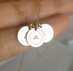 "Dainty, sweet and so very pretty! You can place the initials of all your darling sunshines on one delicate 14k gold fill necklace. Each disc is approximately 9mm in diameter and is made of 14k gold fill. A tiny initial will be engraved in the center of the disc which is uniquely embellished with a sun ray pattern. A 14k gold fill spring ring clasp is provided for easy opening and closing. Please don't forget to let me know what initial(s) you would like to have engraved in the \"note to seller\ Cute Personalized Everyday Jewelry, Cute Everyday Personalized Jewelry, Dainty Stamped Yellow Gold Jewelry, Cute Gold Jewelry For Anniversary, Dainty Stamped 14k Gold Jewelry, Dainty 14k Gold Charm Necklace For Anniversary, Dainty 14k Gold Stamped Jewelry, Dainty Hand Stamped Necklace For Birthday, Dainty Hand-stamped Necklace For Birthday