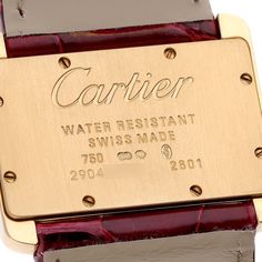 Cartier Tank Divan Mini Yellow Gold Red Strap Ladies Watch W6300356. Quartz movement. 18K yellow gold case 31.5 x 25.0 mm. Circular grained crown set with the blue faceted sapphire. 18K yellow gold fixed smooth bezel. Scratch resistant sapphire crystal. Silver dial. Painted black Roman numeral hour markers. Sword-shaped blue hands. Secret Cartier signature at X. Red leather strap with 18K yellow gold tang buckle. Vintage Cartier Gold Watch Accessories, Vintage Gold Cartier Watch Accessories, Anniversary Yellow Gold Watch Accessories With Diamond Hour Markers, Luxury Engraved Yellow Gold Watches, Designer Gold Cartier Watch, Gold Rectangular Cartier Watch, Gold Rectangular Cartier Watch Accessories, Designer Yellow Gold Watch Accessories With Polished Finish, Cartier Polished Finish Gold Watch Accessories