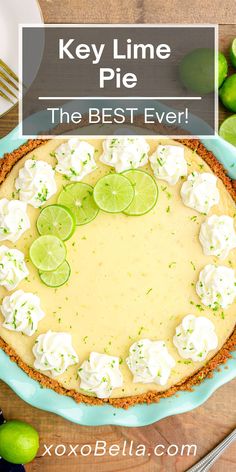 key lime pie on a blue plate with limes around it and the text overlay reads key lime pie the best ever