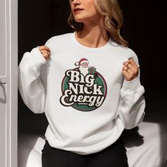 big nick energy, christmas pjs, ugly xmas sweater, ugly christmas shirt, san francisco, white elephant gift, new year shirt, funny christmas gift, ugly sweater, graphic sweatshirt, friend christmas, christmas pajamas, funny christmas, christmas sweatshirt, womens sweatshirt, lounge wear, friend gift, HOW TO ORDER: 1- Please check all of the photos. 2- Select your T-shirt size from selection box. 3- Select your T-shirt color from the selection box. 4- Personalization box is only for design color Winter Fan Apparel Sweater With Graphic Print, Winter Graphic Print Fan Sweater, White Funny Print Winter Sweatshirt, White Sweatshirt With Funny Print For Winter, White Winter Sweatshirt With Funny Print, Christmas Cotton Sweater For Streetwear, Big Nick Energy, Sweater Graphic, Ugly Xmas Sweater