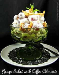 a glass bowl filled with food on top of a white plate