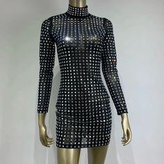 Expertly crafted with stunning rhinestone detailing, this long-sleeved mesh mini dress is a showstopper. Its slim fit and mock neck add a touch of elegance while the see-through design adds an alluring edge. Elevate your style with this sleek black dress. Fabric: Medium Stretch Material: Polyester, Elastane Sleek Black Dress, Mesh Mini Dress, Rhinestone Dress, Rhinestone Decor, Fabric Medium, Mini Black Dress, Dress Fabric, Mock Neck, Best Sellers