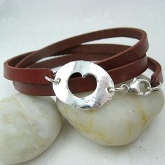 Hole Hearted Leather Wrap Bracelet $45.00 https://cloverleafjewelry.com Leather Braclet, Dark Red Brown, Banner Elk, Triple Wrap Bracelet, Handmade Leather Bracelets, Light Weight Jewelry, Necklaces And Bracelets, Jewelry Simple, Round Leather